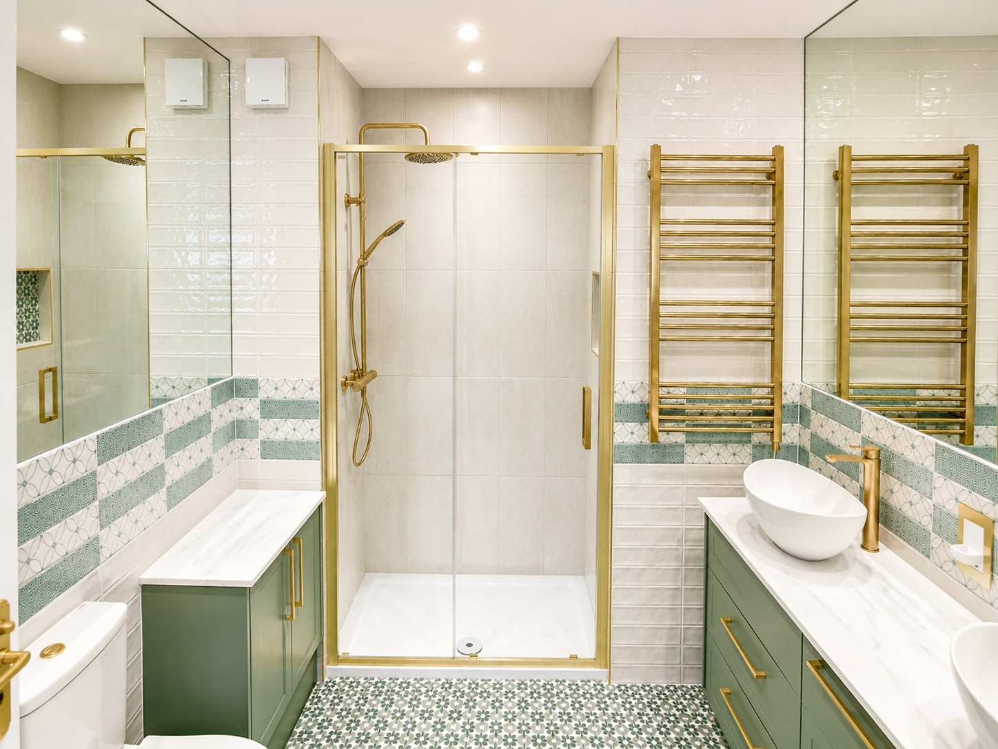 Elegant bathroom with green vanity units, gold fittings and walk-in shower